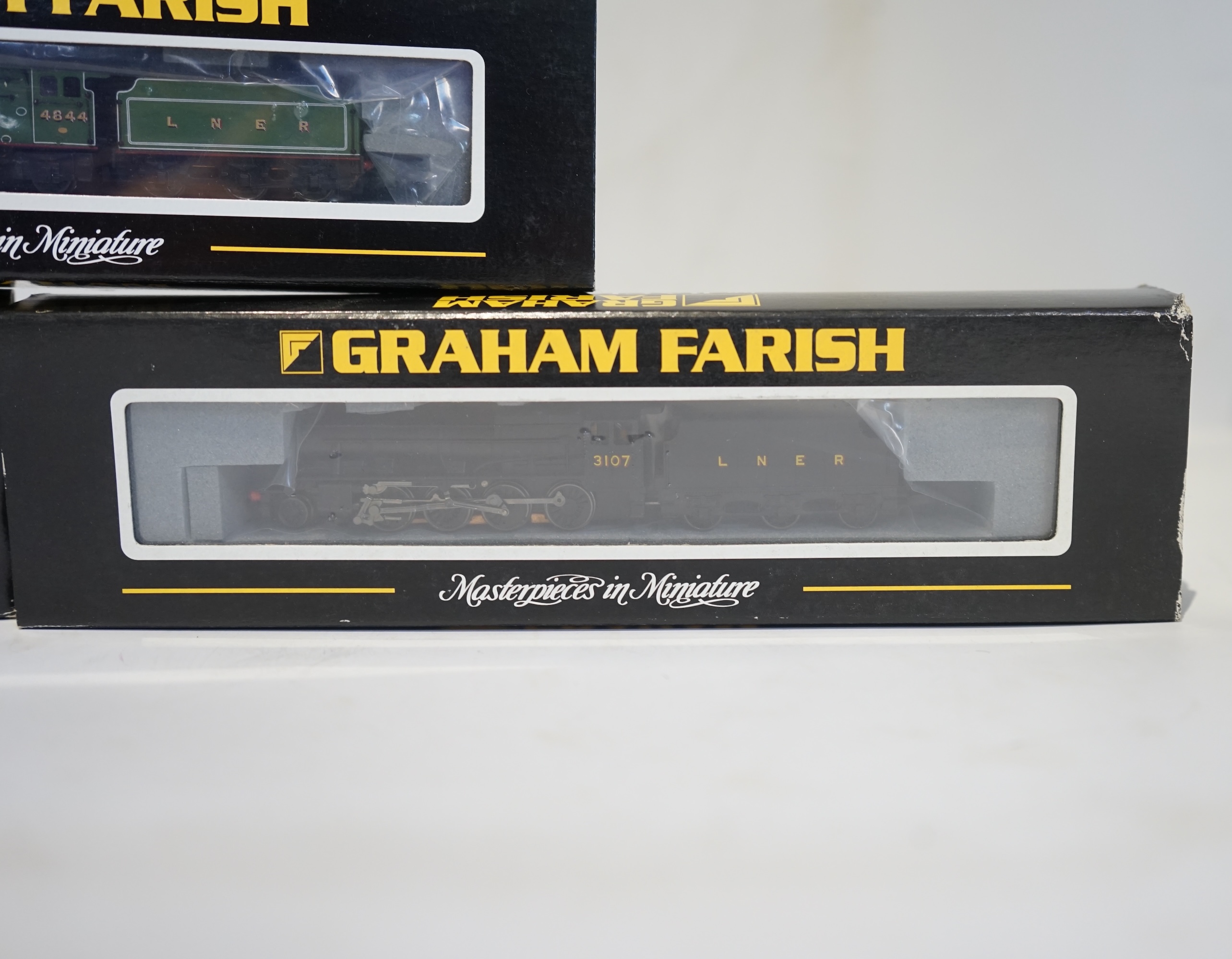 Three boxed Graham Farish N gauge railway LNER tender locomotives; a Class 8F, 3107 (372-150), a Class 8F, 3107 (372-150), and a Class V2, 4844 (372-602). Condition - good.